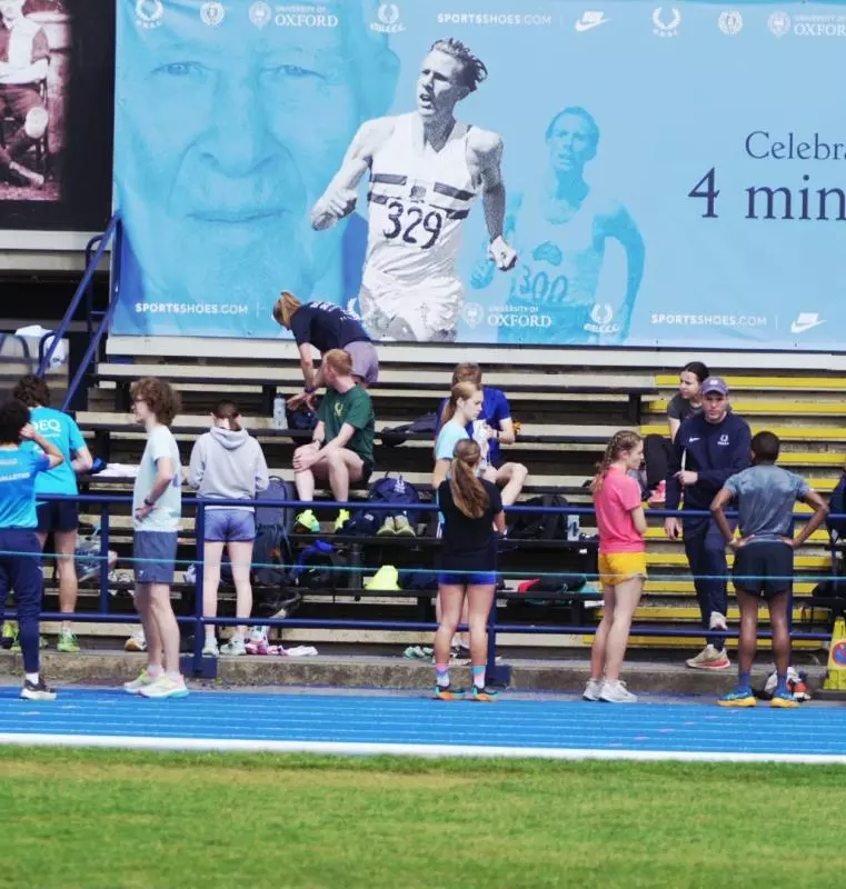 Runners gathering by track